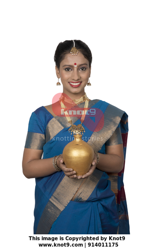 South Indian housewife with a piggy bank Stock Video | Knot9