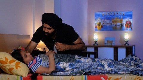 An Indian father checking his daughter's fever with a digital thermometer - cough and cold, Viral infection