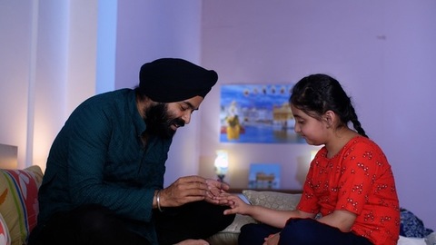 Indian father applying nail paint on her daughter's nails - cosmetic, father-daughter bonding