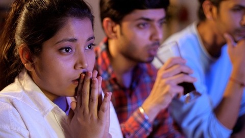 Close-up of three friends feeling anxiety while watching the cricket - sports enthusiasts, Indian sports fans, cricket world cup, T20